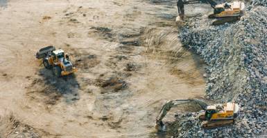 Mining site with trucks and machinery
